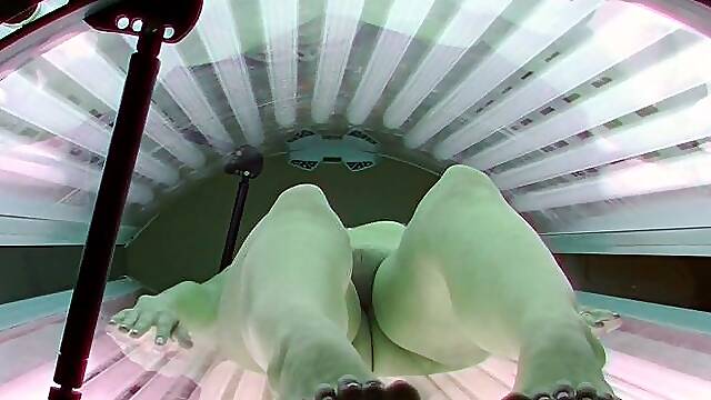 Young beauty in solarium