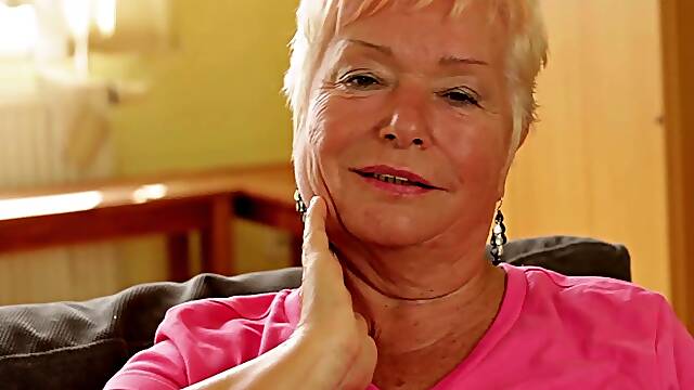 Slutty granny sticks a huge dildo deep inside of her twat
