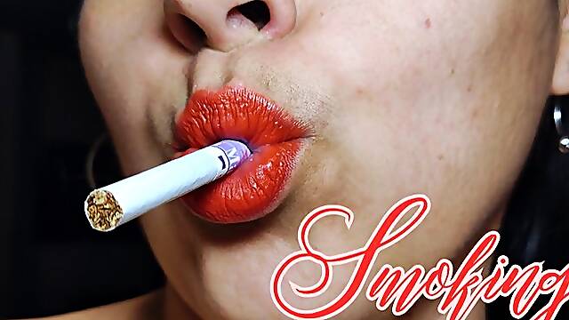 Smoking red lips close up